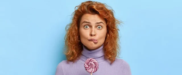 Girl eating lolipop and being adiccted to sugar