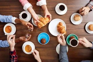 People hands wooden table with croissants coffee thumb