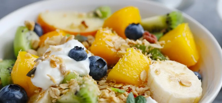 Muesli with fruits served bowl